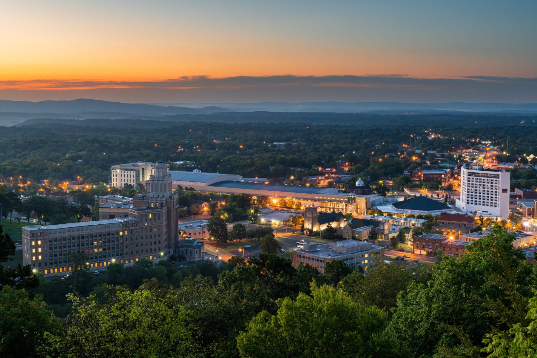 Hot Springs, Arkansas, USA town skyline from above at dawn.